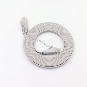 Gray Cat6 flat Ethernet patch cable with two snagless RJ45 male connectors on white background