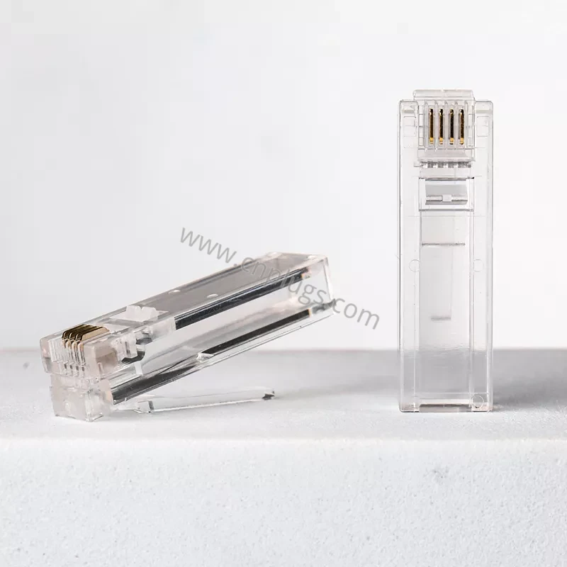 Erweiterter 6P4C RJ11-Telefonstecker | Langes Gehäuse, goldene 3-Stift-Kontakte 3 Two long-body 6P4C gold telephone plugs standing and lying for recessed jack applications