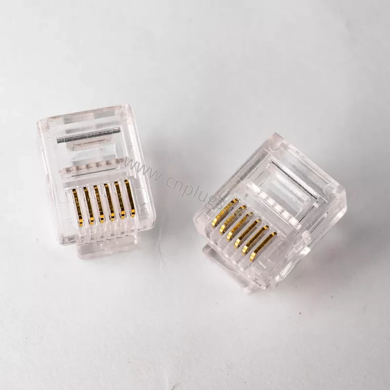 RJ12 6P6C Telephone Modular Plug 1 Two clear 6P6C RJ12 gold modular telephone plugs angled product shot for OEM catalog